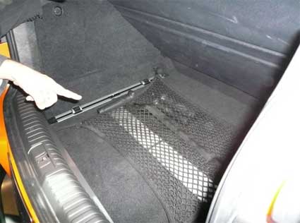 Behind the rear seat